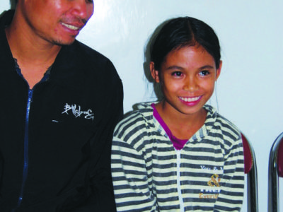 Karina & her father after her sight is restored.